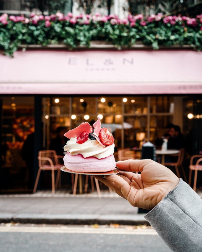 photo of person holding delicious cake