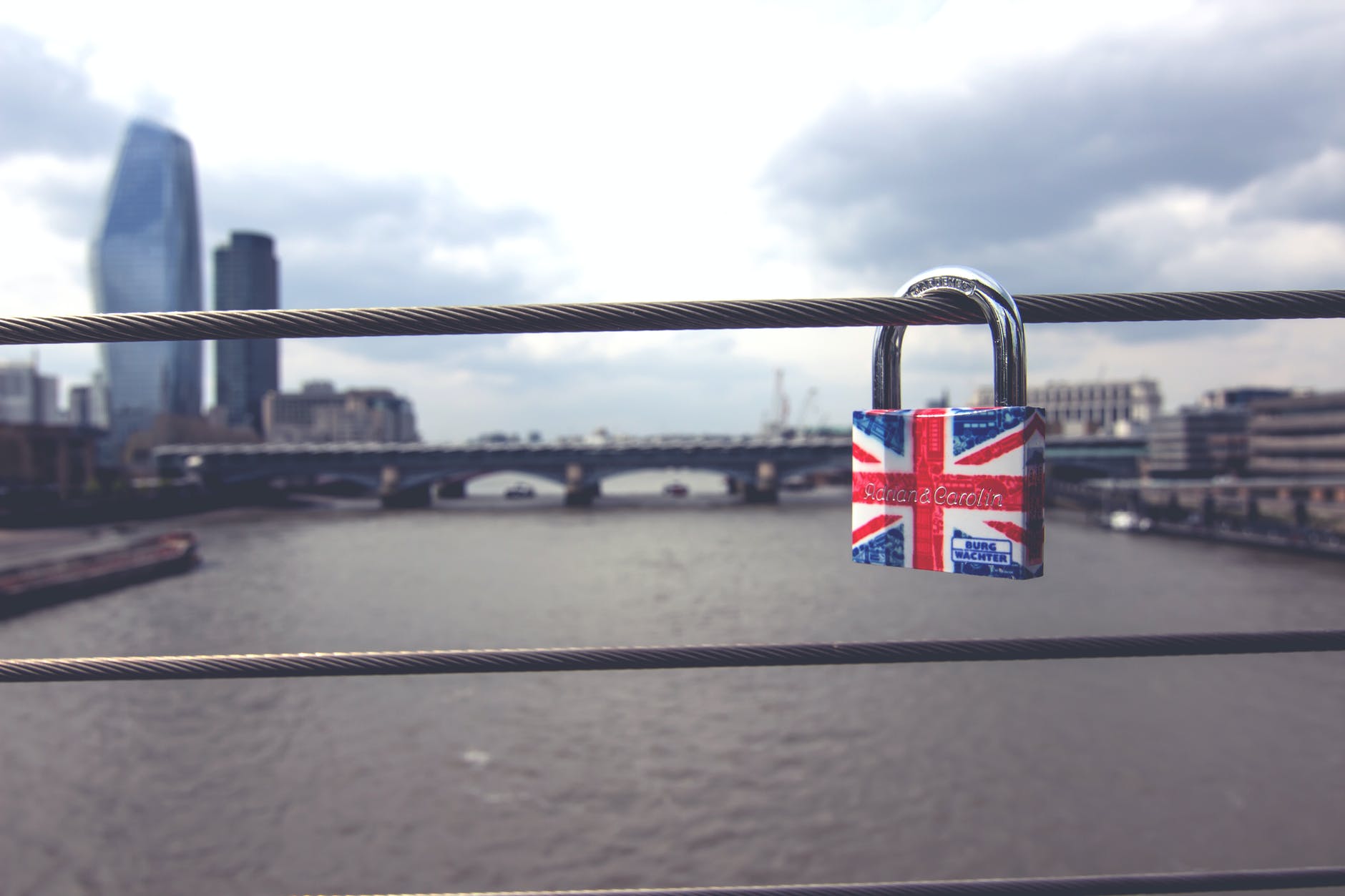 padlock on grey metal cable